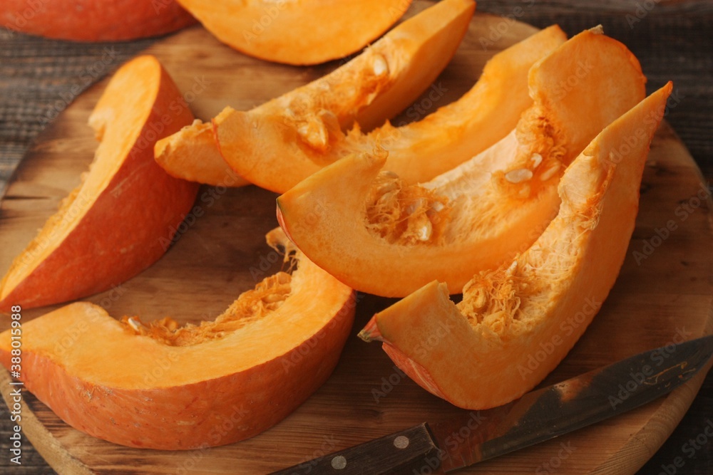 Fresh ripe pumpkin on a wooden table Fresh ripe pumpkin on a wooden table