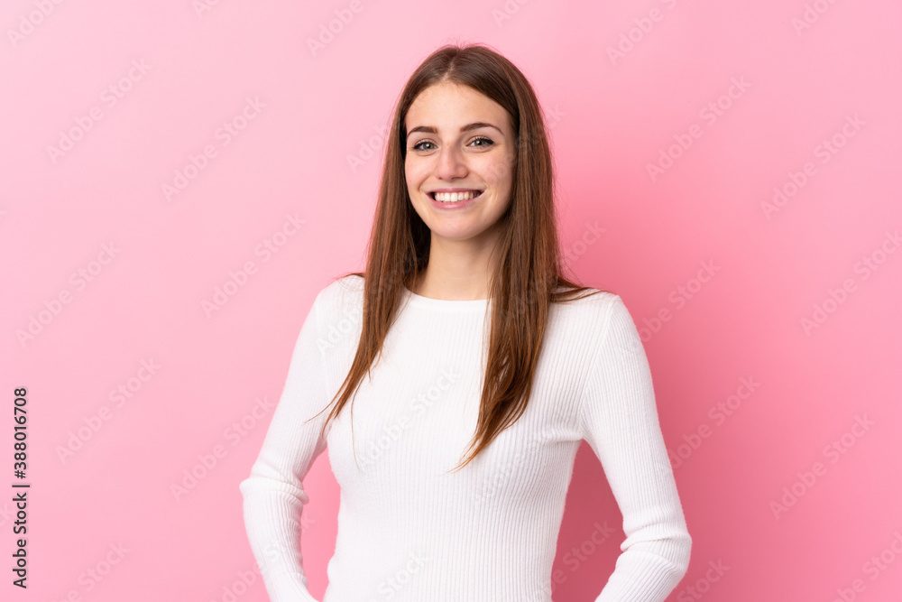 Young woman over isolated pink background laughing