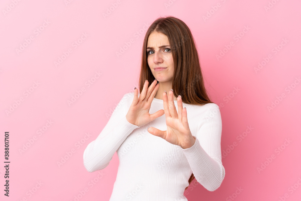 Young woman over isolated pink background nervous stretching hands to the front Young woman over isolated pink background nervous stretching hands to the front