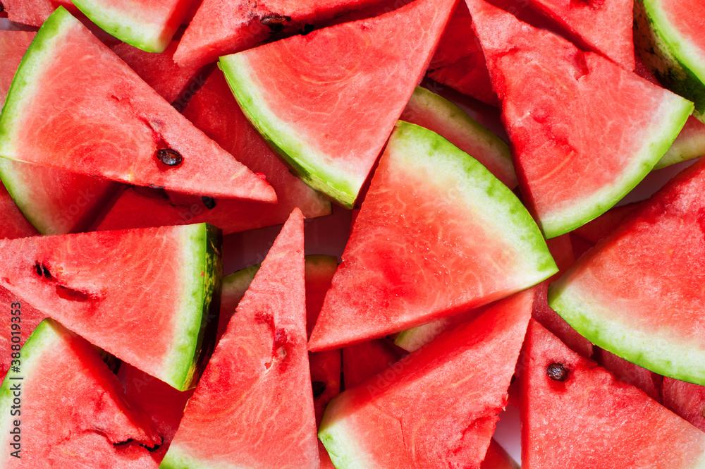 Slices of ripe red watermelon. View from above. Background, texture Slices of ripe red watermelon. View from above. Background, texture
