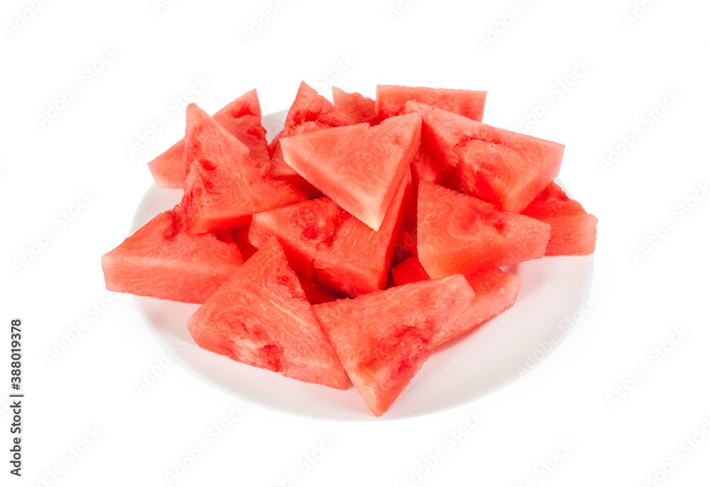 Lots of small triangular slices of ripe red watermelon on a plate. Isolated on white background Lots of small triangular slices of ripe red watermelon on a plate. Isolated on white background