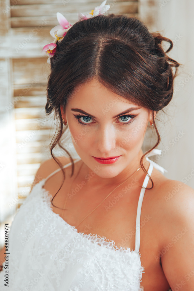 Wedding day and beautiful bride in studio. Beautiful young bride with wedding makeup and hairstyle. Portrait of young gorgeous bride. Wedding.