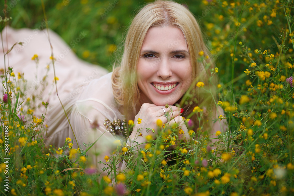 beautiful girl walking in a blooming field beautiful girl walking in a blooming field