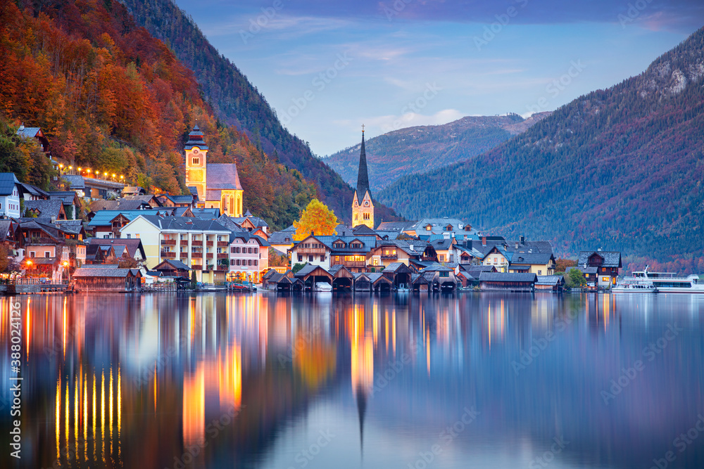 Hallstatt, Austria. Cityscape image of famous alpine village Hallstatt at dramatic autumn sunset.