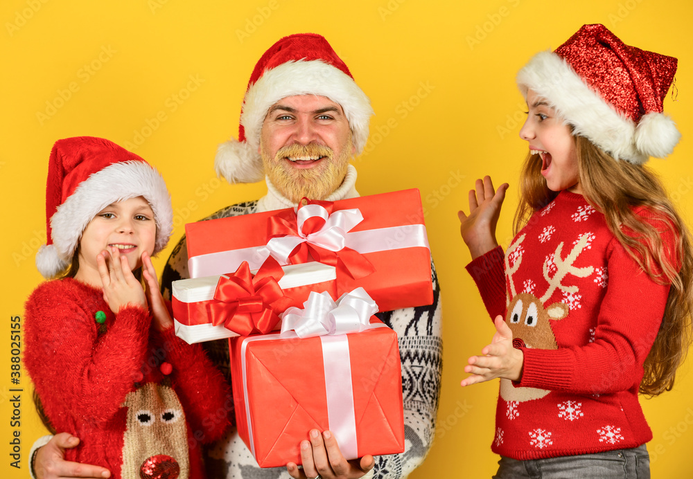 Fototapeta premium Christmas eve concept. Presents for everybody. Family shopping. Christmas sale. Dad kids having fun. Father and little daughters celebrate new year together. Christmas becomes special with children