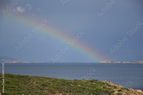 Rainbow over the sea at Sardinian coast, Italy