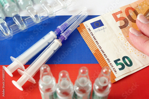 russian flag, vaccine sputnik-V or EpiVacCorona and money, money for purchase and production vaccine concept