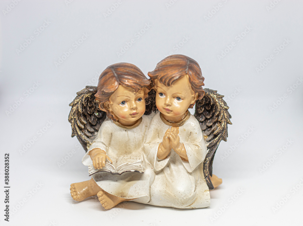 Two angels reading and praying Two angels reading and praying