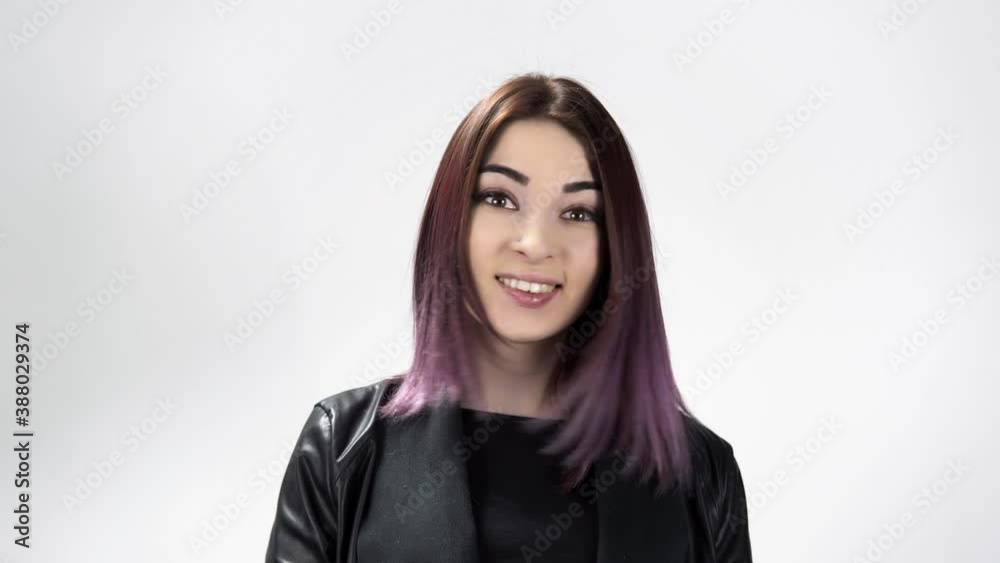 Portrait of a young astonished woman saying wow on the white background. A beautiful caucasian lady is surprised by the positive news. She is cheerful and amazed. Concept of person's mood and emotions Portrait of a young astonished woman saying wow on the white background. A beautiful caucasian lady is surprised by the positive news. She is cheerful and amazed. Concept of person's mood and emotions