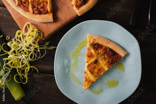 A slice of pizza in a blue plate