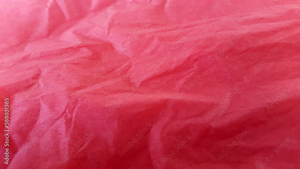 Fototapeta premium Crumpled red paper. Creative vintage background