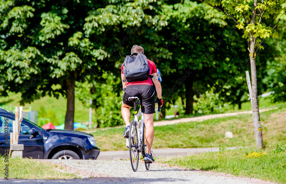 Fototapeta premium Cyclist ride on the bike path in the city Park 