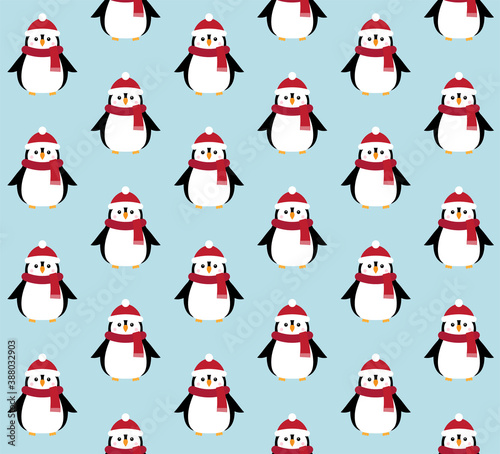 Vector seamless pattern of flat cartoon penguin in hat and scarf isolated on blue background