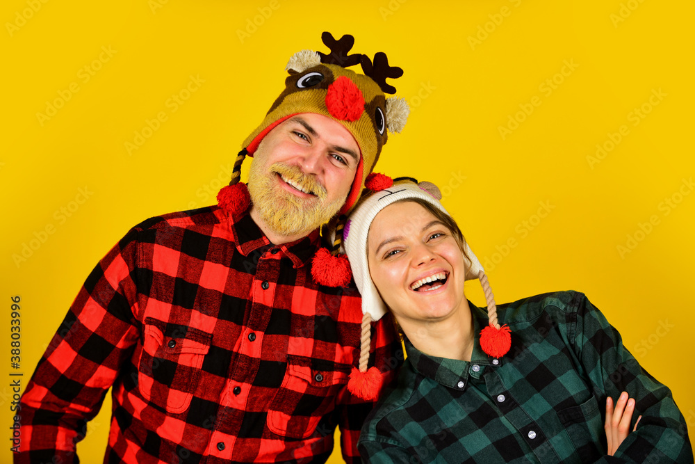 Christmas party. Having fun. Decide what style you are going for. Family tradition. Christmas time. Loving couple wear funny hats. Romantic feelings. Couple in love christmas holiday celebration Christmas party. Having fun. Decide what style you are going for. Family tradition. Christmas time. Loving couple wear funny hats. Romantic feelings. Couple in love christmas holiday celebration