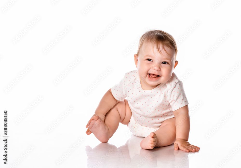 Cute little girl wearing a summer white bodysuit on a white background. Cute little girl wearing a summer white bodysuit on a white background.