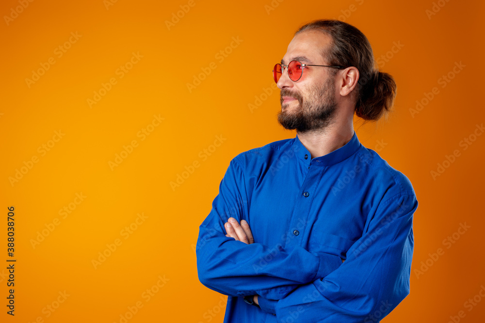 Cool long haired joyful man wearing glasses