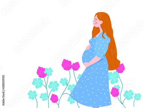 Beautiful blond pregnant woman on a floral background. Happy mother-to-be is gently stroking her big belly.