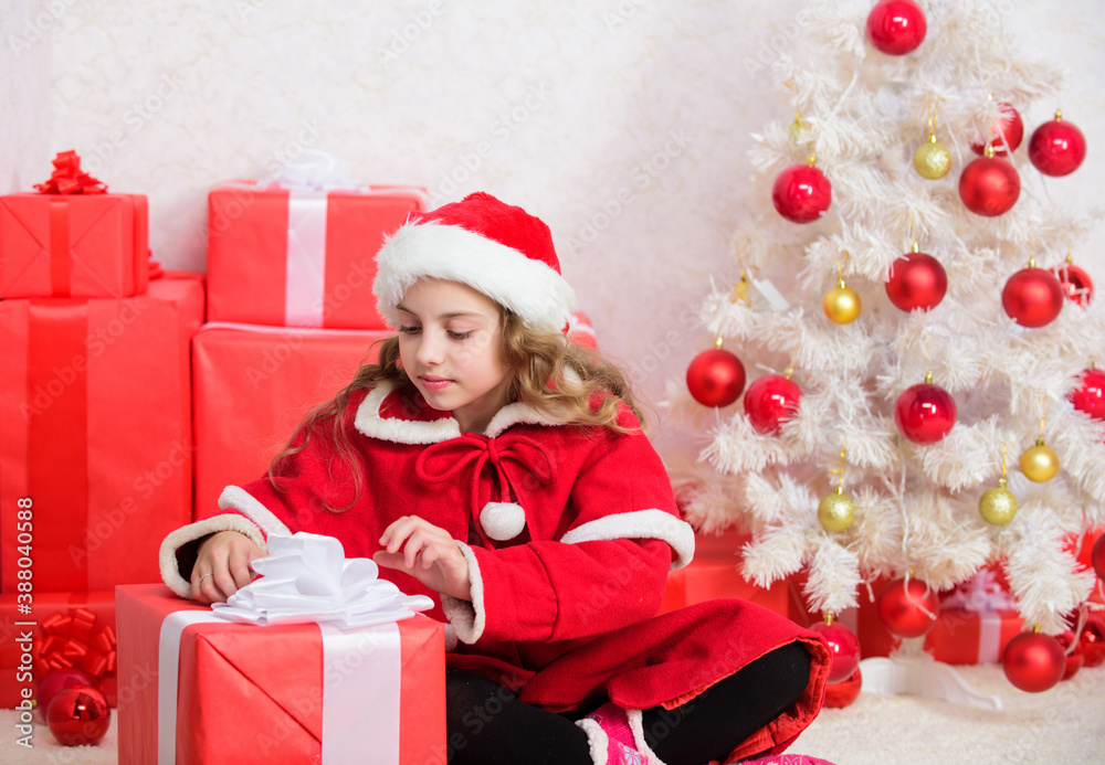 Santa bring her gift. Winter shopping sales. Christmas spirit is here. Unpacking christmas gift. Winter holiday tradition. Kid happy with christmas present. Girl celebrate christmas open gift box