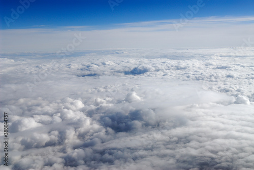 Flying above white puffy clouds