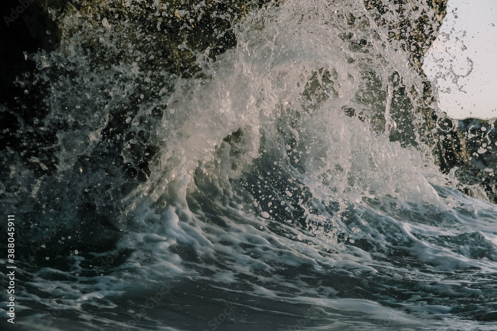 waves crashing against cliff waves crashing against cliff