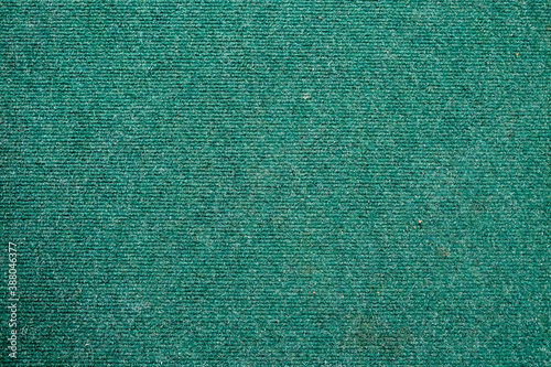Fotografie A green carpet texture, close-up, green background