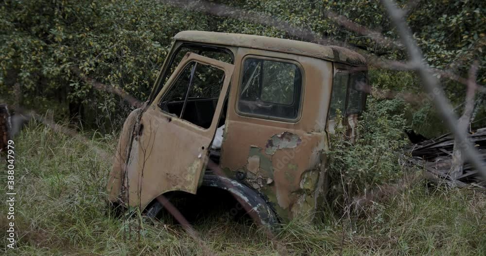 Old rusty truck wreck by the forest of Chernobyl in Ukraine Old rusty truck wreck by the forest of Chernobyl in Ukraine