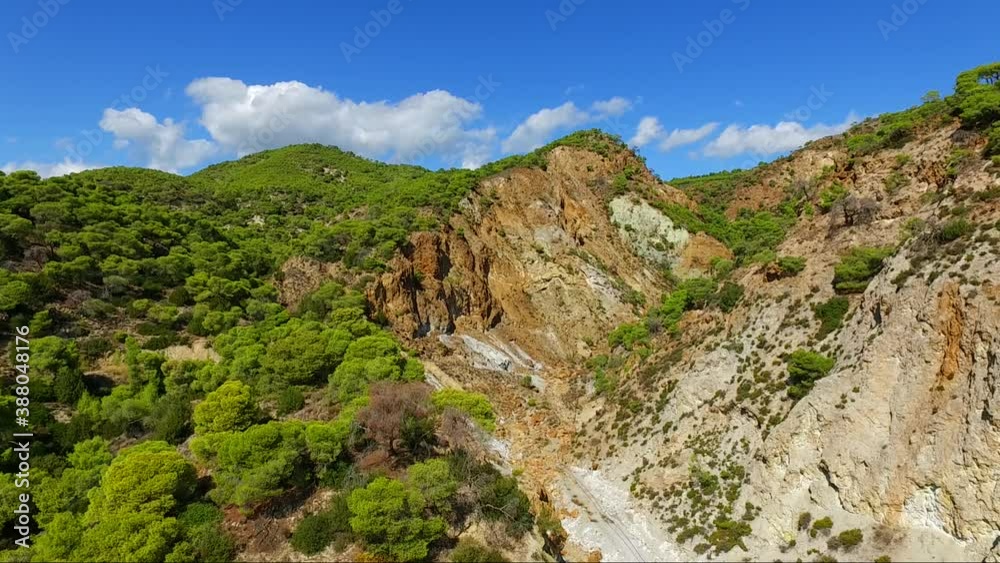 Aerial view of Sousaki extinct volcano of the Hellenic Volcanic Arc, Corinthia, Greece. Colourful rocks and ash and interesting geological features. Aerial view of Sousaki extinct volcano of the Hellenic Volcanic Arc, Corinthia, Greece. Colourful rocks and ash and interesting geological features.