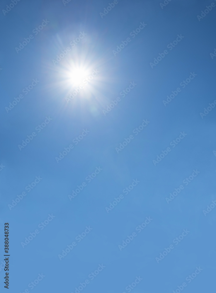 blue sky with shining sun, vertical shot blue sky with shining sun, vertical shot