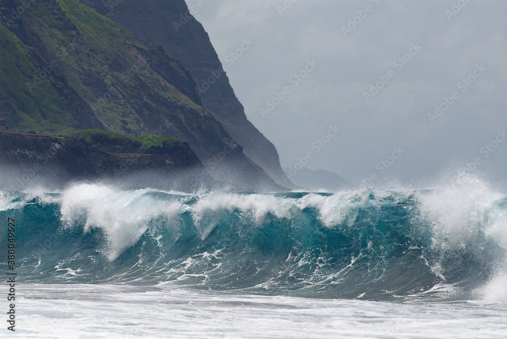 Blue wave breaking on Kalaupapa leper colony beach on Molokai