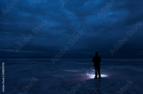 silhouette of a man walking on the storm