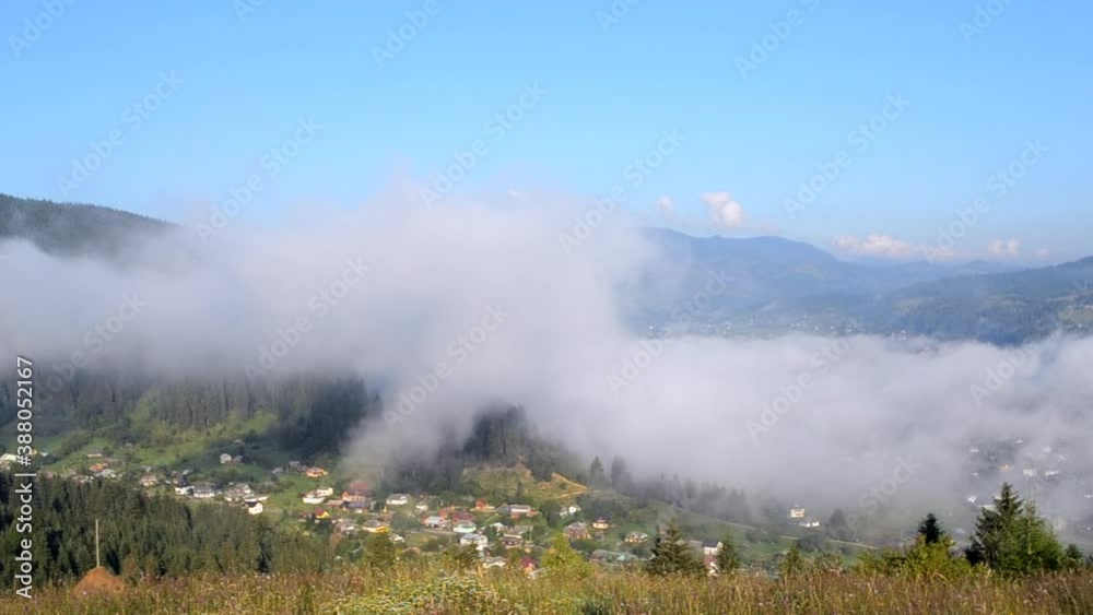 Morning fog dissipates in the mountains Carpathians. Morning fog moves Morning fog dissipates in the mountains Carpathians. Morning fog moves