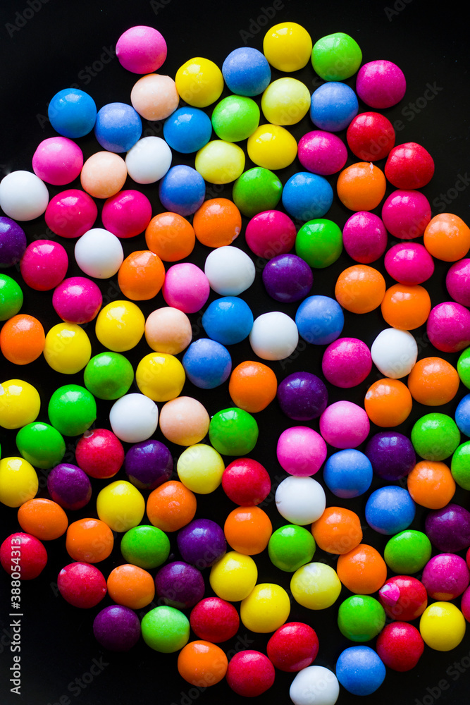 Obraz premium Skittles candy on the table, colorful sweet candy