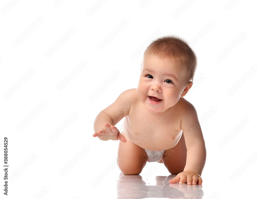 Cute little baby with evil smile crawling on floor Cute little baby with evil smile crawling on floor