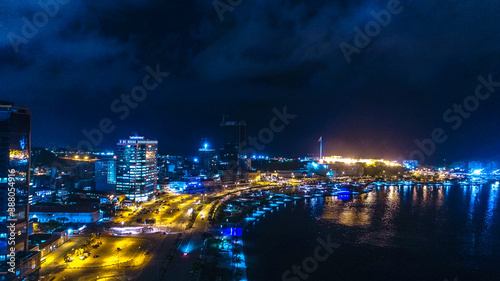 Road, lights and sea at night. Luanda city captured from the top