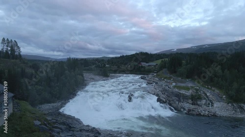 A wide and powerful river with a big waterfall, located in northern Norway. photo