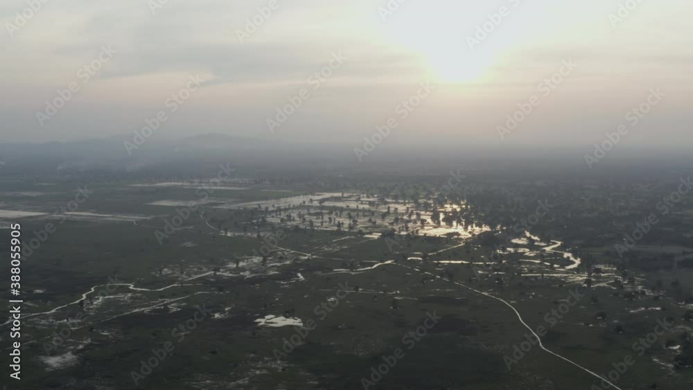 Fly over Rice fields and irrigation system in Battambang province in Cambodia at dusk Fly over Rice fields and irrigation system in Battambang province in Cambodia at dusk
