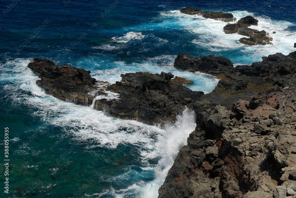 Lava rocks and crashing waves at Mokolea Point Maui