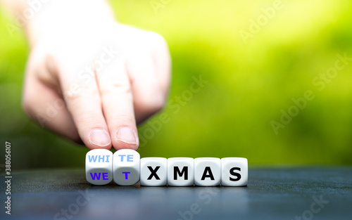 White or wet christmas? Hand turns dice and changes the expression "wet xmas" to "white xmas".