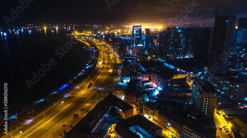 Road, lights and sea at night.
Luanda city captured from the top