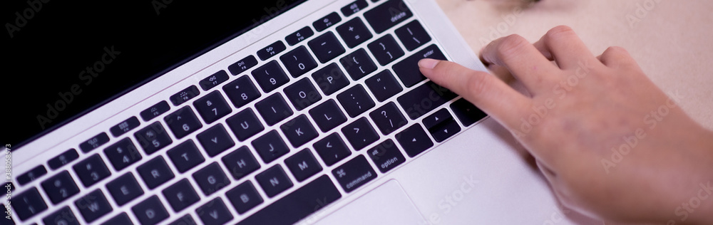 Hand of woman touch keyboard for Online Shopping Payment at the store, Credit Card Concept, Black Friday festival, Order shopping. Hand of woman touch keyboard for Online Shopping Payment at the store, Credit Card Concept, Black Friday festival, Order shopping.