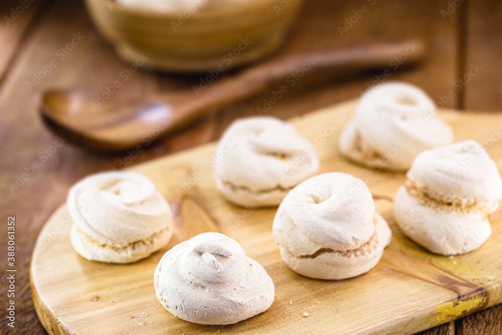 portion of homemade cookies, called meringue or sighs, typical egg yolk cake with sugar portion of homemade cookies, called meringue or sighs, typical egg yolk cake with sugar
