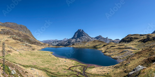 Pic du Midi d'Ossau mountain and Lac Gentau mountain lake in Ossau Valley, iconic symbol of the French Pyrenees, Pyrenees National Park © nomadkate