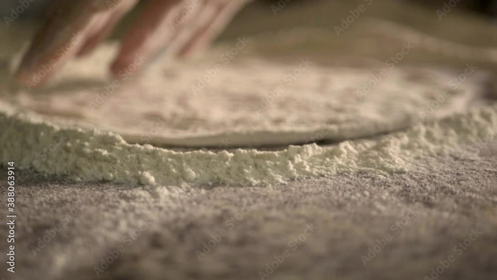 Knead pizza dough and form a pizza Knead pizza dough and form a pizza