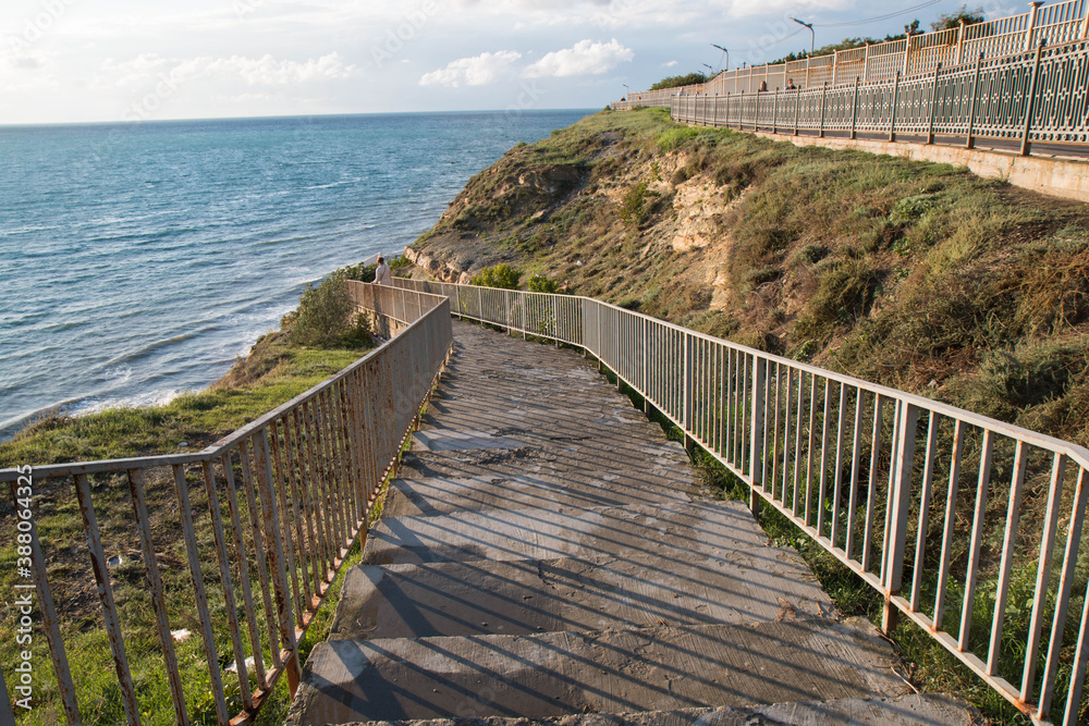 stairs leading to the sea against the sky