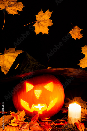 Halloween Still Life Colorful Theme Scary Decorated Dark and yellow maple leaves Room with Burning Pumpkin, Candlestick