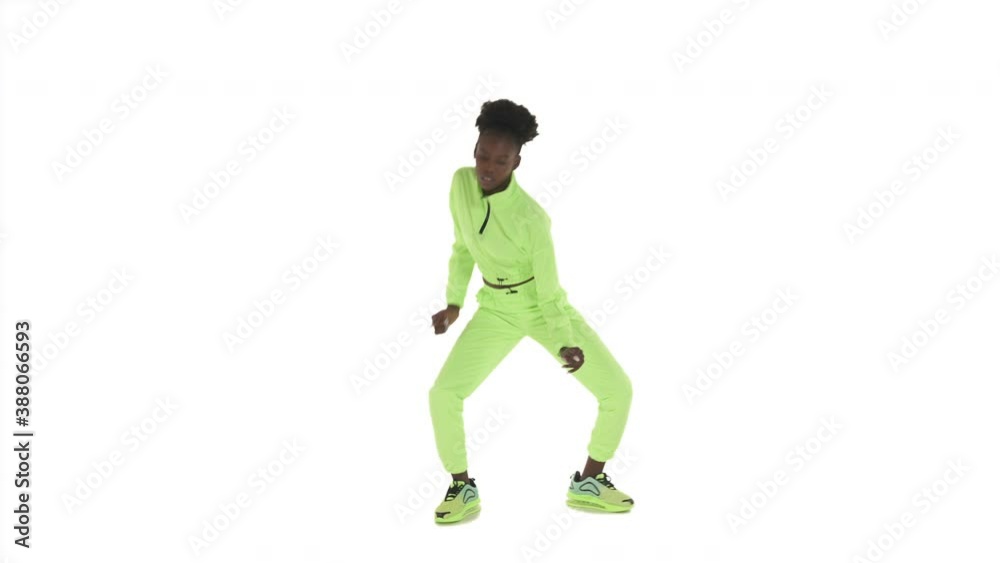 Portrait in full length of African American woman performing fast energetic hip-hop moves. Street dance. Isolated on white background Portrait in full length of African American woman performing fast energetic hip-hop moves. Street dance. Isolated on white background