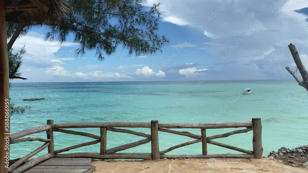 Patio view of the ocean in luxury resort, Zanzibar, slow motion track forward Patio view of the ocean in luxury resort, Zanzibar, slow motion track forward