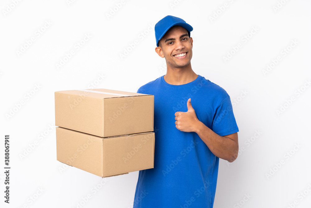 Delivery man over isolated white background with thumbs up because something good has happened