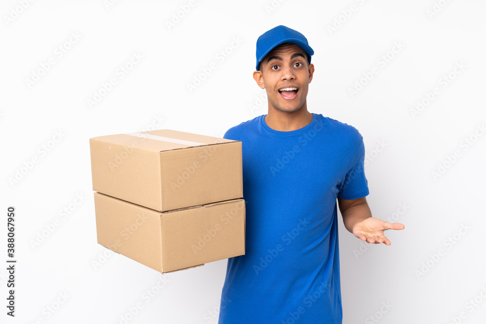 Delivery man over isolated white background with shocked facial expression Delivery man over isolated white background with shocked facial expression