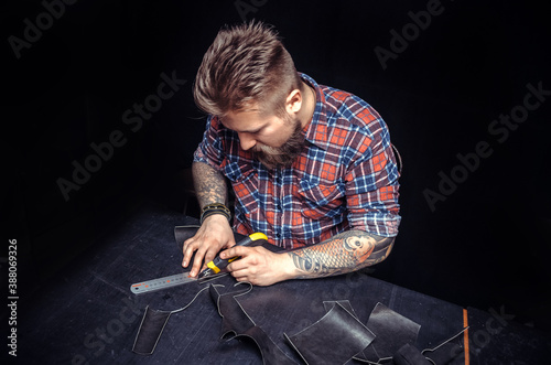 Professional Tanner producing a leatherwork photo